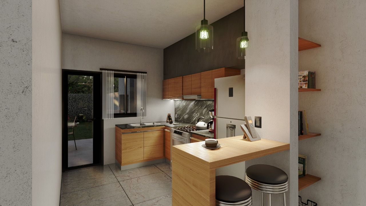 Cocina integrada con barra de una vivienda CALA
